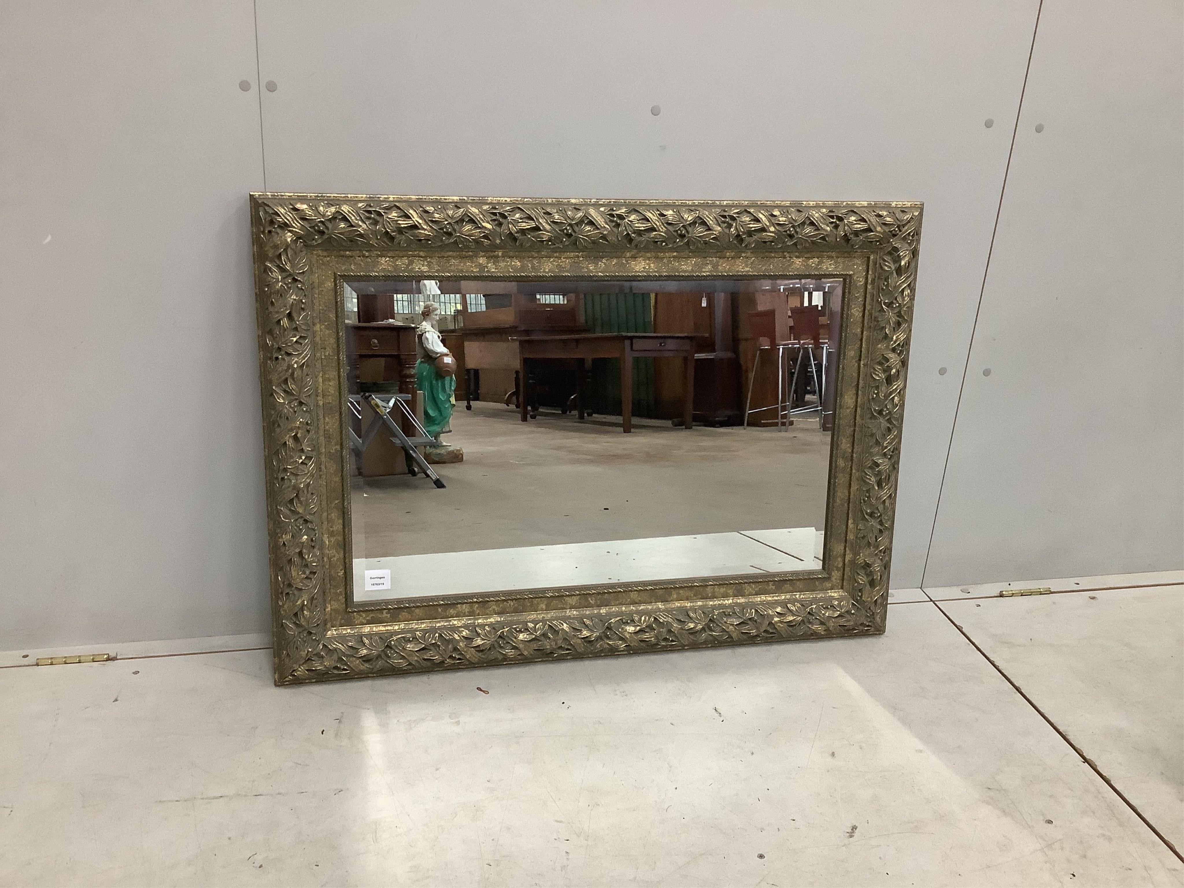 A Victorian style silvered composition rectangular wall mirror, width 77cm, height 108cm. Condition - good